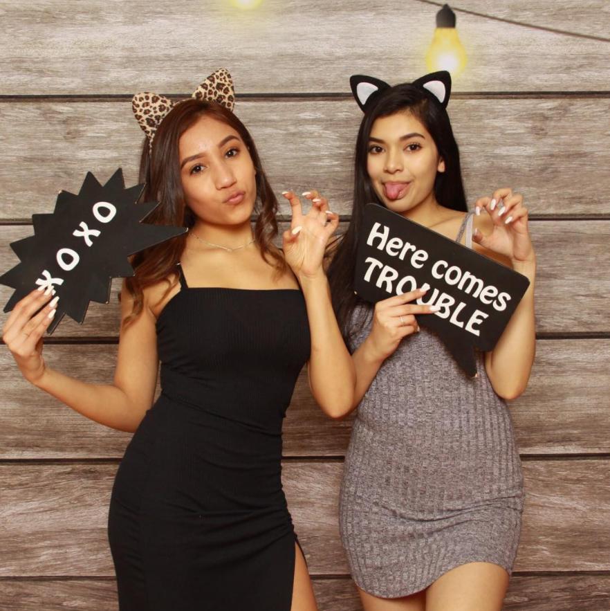 Two girls having their picture taken in our photo booth